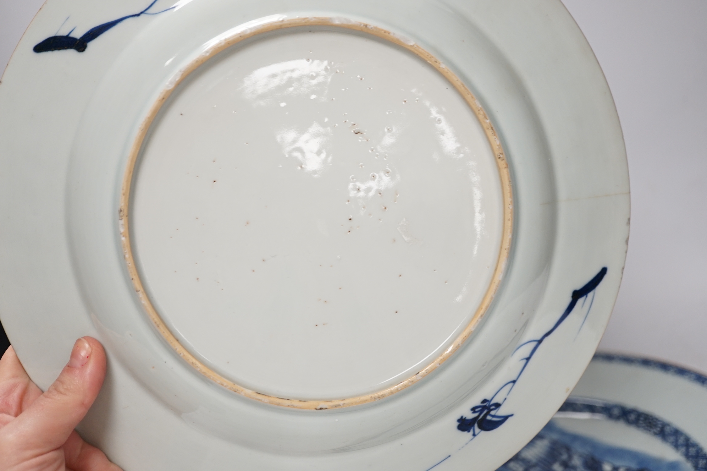 Three Chinese blue and white dishes or plates, Kangxi to Qianlong period and two later covers, largest plate 32cm diameter